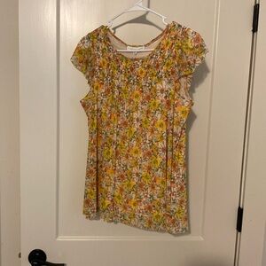 Lined top. Cap sleeve, smocked bodice in front plain bodice in back.